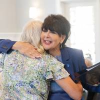 President Mantella giving a hug to a fellow event attendee